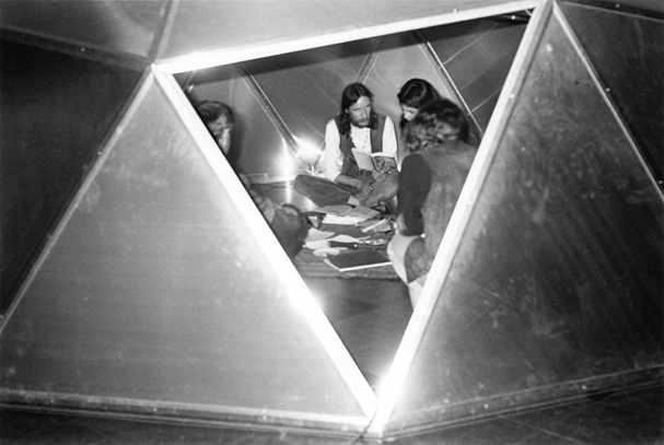 Poetry Front: Poet and group in aluminum sheet dome